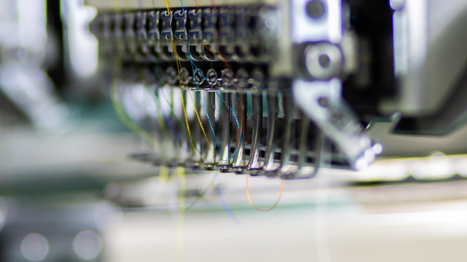 Embroidery machine stitching a garment